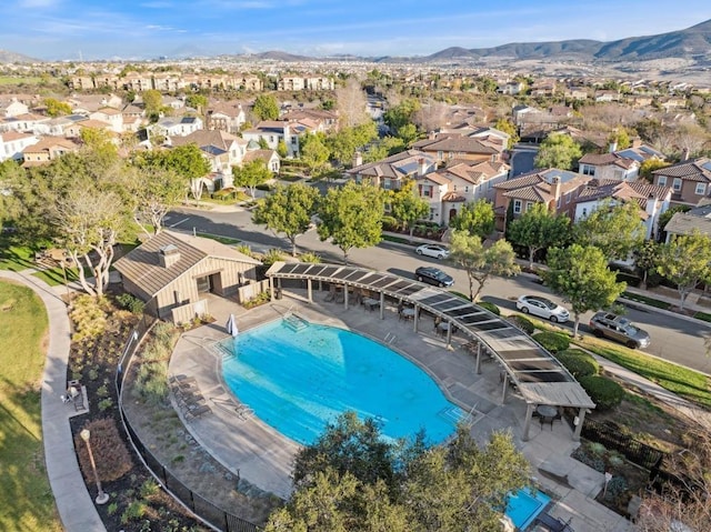 view of swimming pool with a mountain view