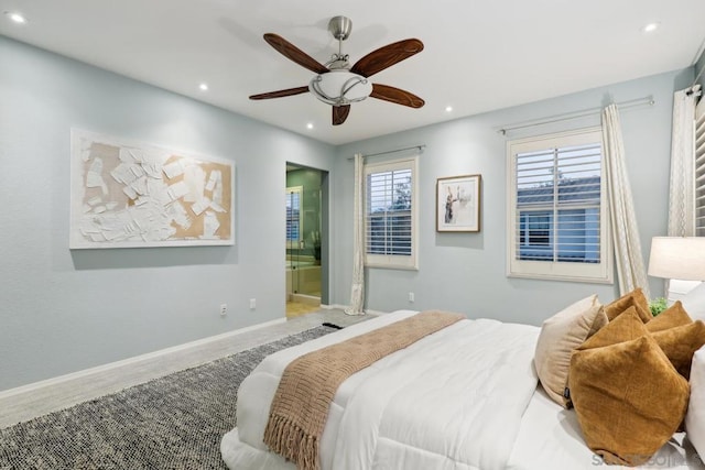 bedroom featuring hardwood / wood-style flooring, ceiling fan, and ensuite bathroom