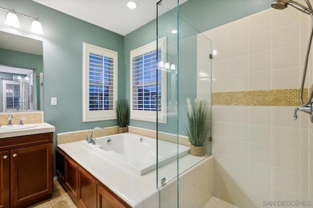 bathroom featuring vanity and plus walk in shower