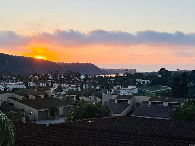 property's view of city with a mountain view