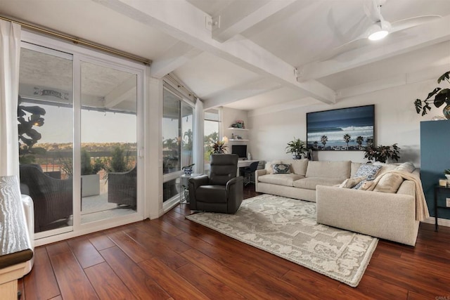 living room featuring dark wood finished floors and beam ceiling