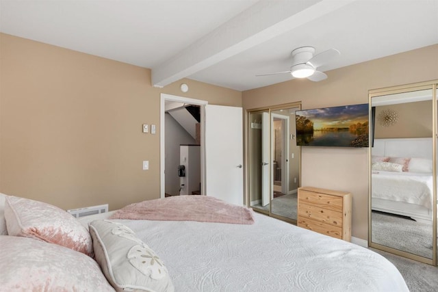 bedroom featuring ceiling fan, visible vents, beam ceiling, and carpet flooring