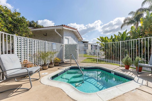 view of pool featuring a patio area and fence