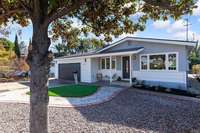 single story home featuring a garage