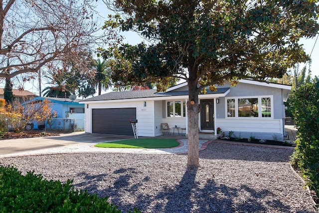 ranch-style house featuring a garage