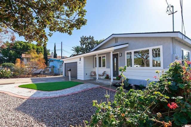 back of house featuring a garage