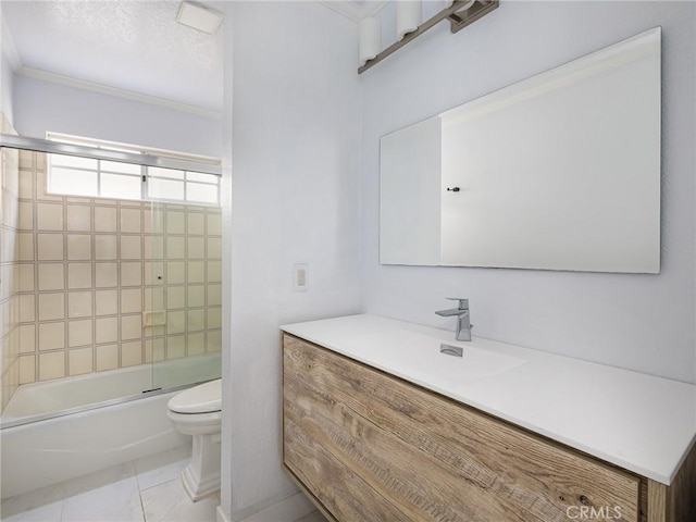 full bathroom with tile patterned floors, toilet, vanity, ornamental molding, and enclosed tub / shower combo