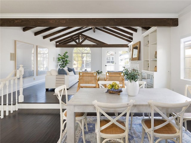 dining space with dark hardwood / wood-style flooring and lofted ceiling with beams