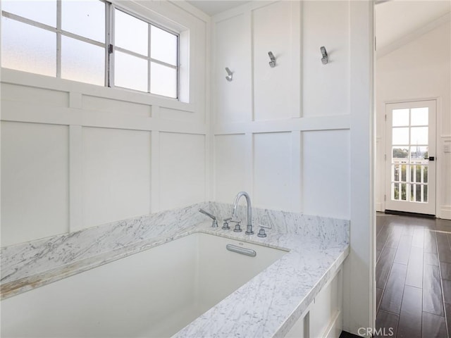 bathroom with hardwood / wood-style flooring