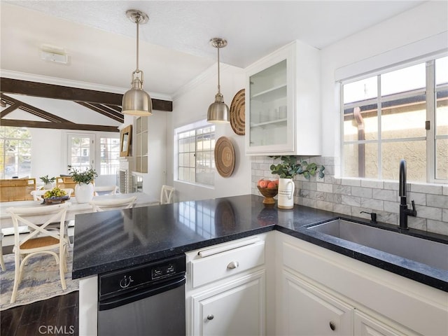 kitchen with sink, white cabinetry, dark hardwood / wood-style floors, tasteful backsplash, and decorative light fixtures