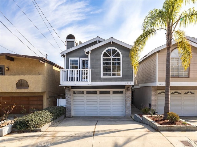 view of front of house featuring a balcony and a garage