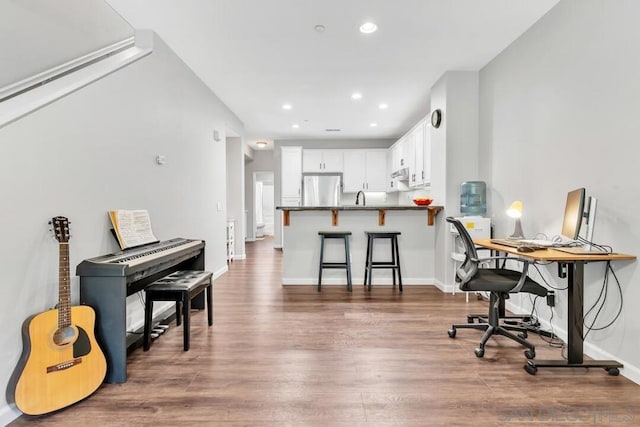 office area featuring sink and dark hardwood / wood-style floors