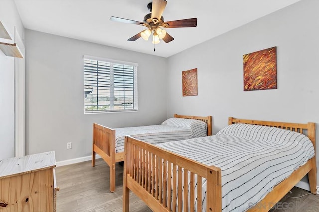 bedroom featuring ceiling fan and light hardwood / wood-style floors