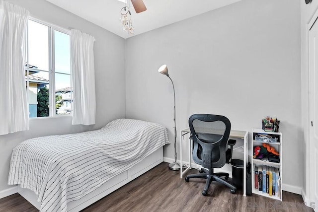 bedroom featuring dark wood-type flooring and ceiling fan