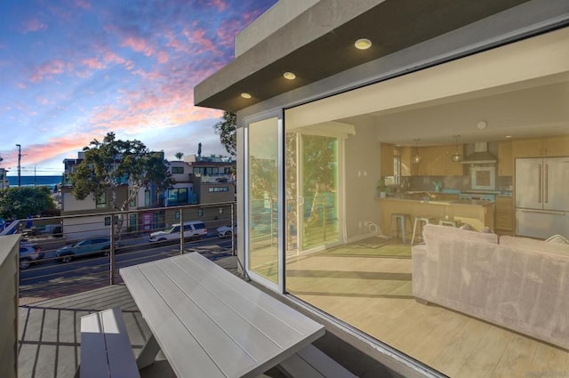 view of balcony at dusk