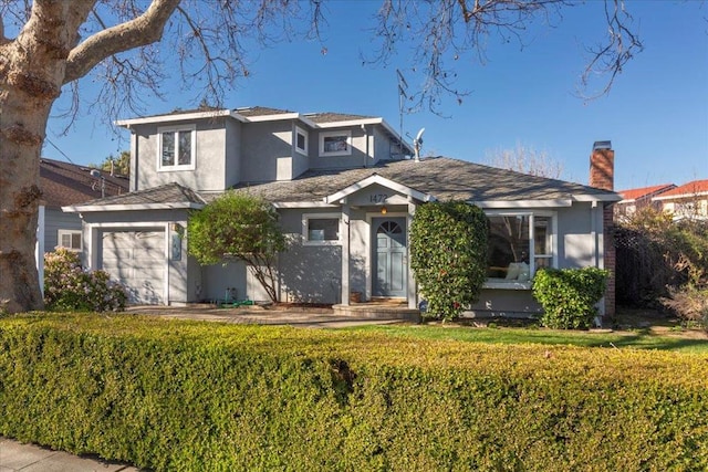 view of front facade with a garage and a front yard