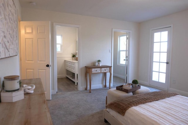 carpeted bedroom featuring connected bathroom