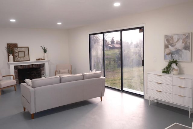 living room with a wealth of natural light and a fireplace