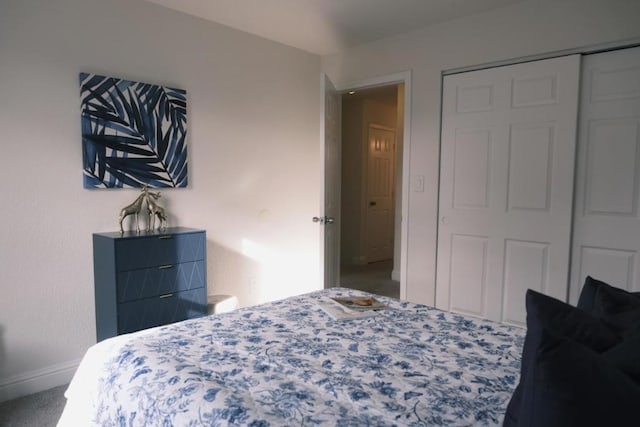 bedroom with a closet and carpet flooring