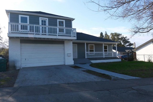 view of front of property with a garage, covered porch, and a front lawn