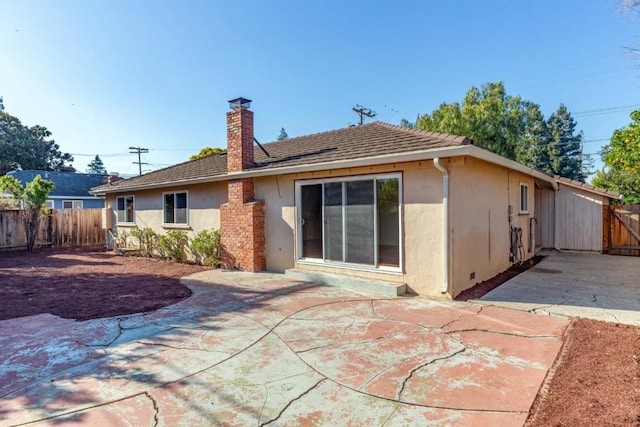 back of property featuring a patio area