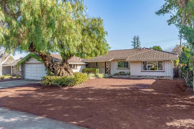 ranch-style house featuring a garage