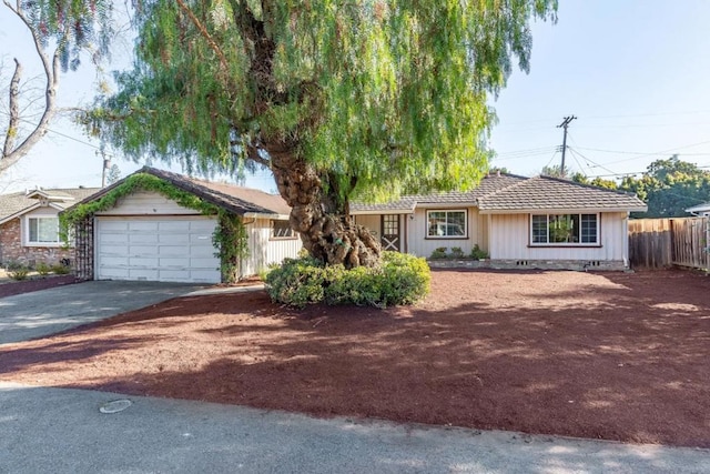 single story home featuring a garage