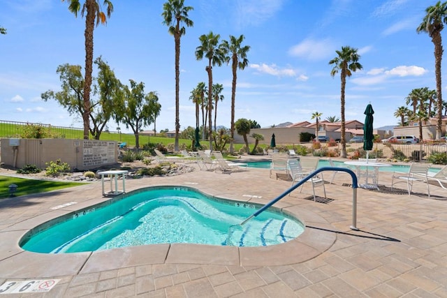 view of pool featuring a patio area