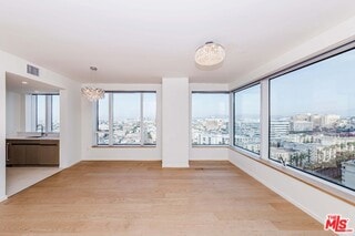 interior space featuring a notable chandelier and light wood-type flooring