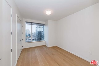 unfurnished room featuring light hardwood / wood-style floors