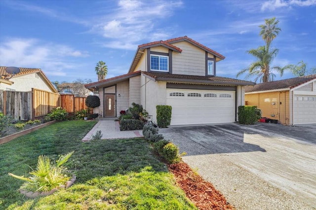 view of property featuring a garage and a front lawn