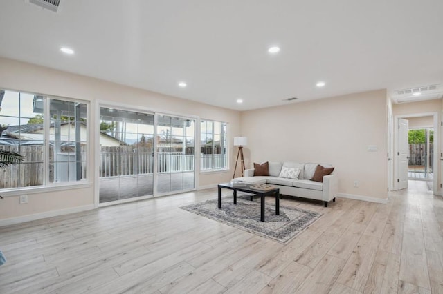 living room with light hardwood / wood-style flooring