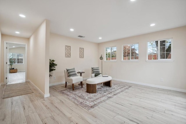 living area with light hardwood / wood-style flooring