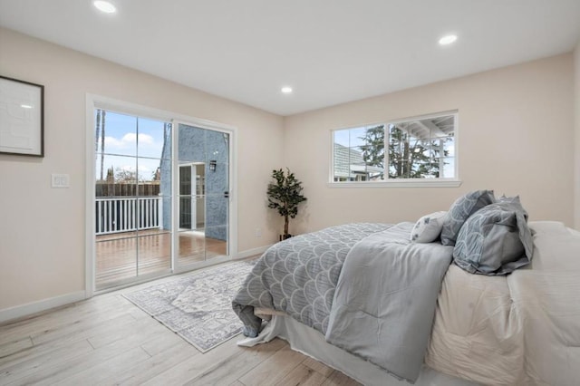 bedroom with access to outside and light wood-type flooring