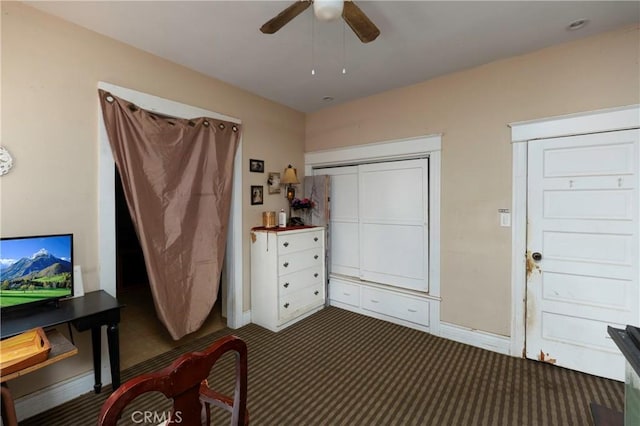 bedroom with a closet, ceiling fan, and carpet