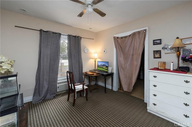 living area featuring ceiling fan and dark colored carpet