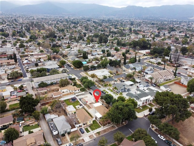 drone / aerial view featuring a mountain view