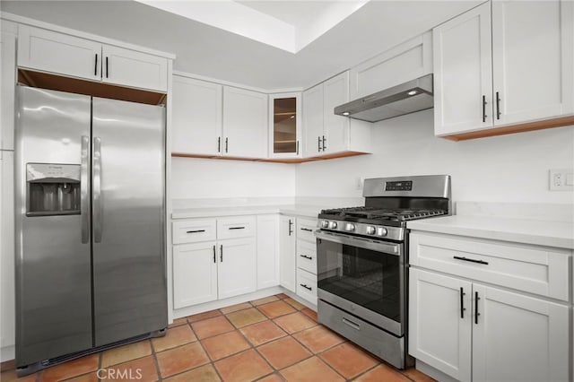 kitchen featuring stainless steel appliances, exhaust hood, white cabinetry, light countertops, and glass insert cabinets