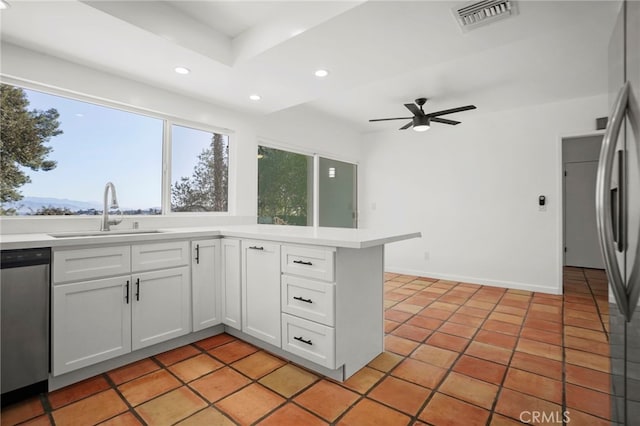 kitchen featuring stainless steel appliances, recessed lighting, visible vents, white cabinetry, and a sink