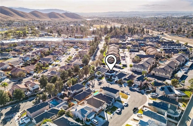 birds eye view of property featuring a mountain view