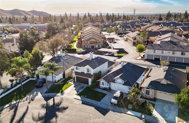 birds eye view of property featuring a mountain view