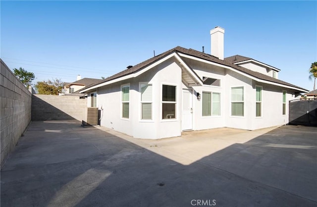 rear view of property with a patio area