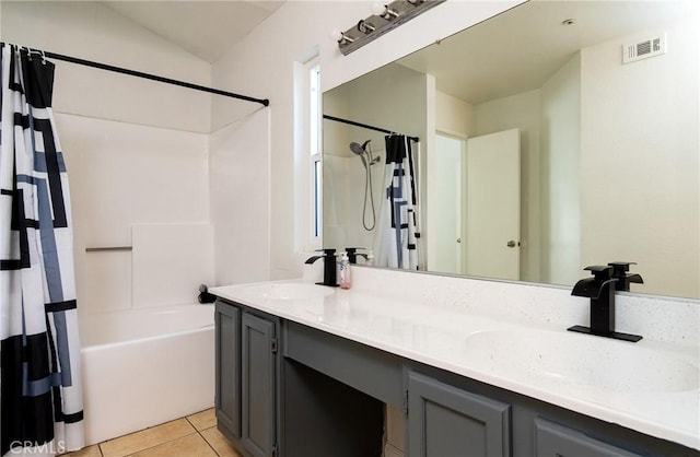 bathroom featuring shower / bath combination with curtain, vanity, and tile patterned floors