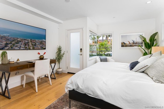 bedroom with hardwood / wood-style floors