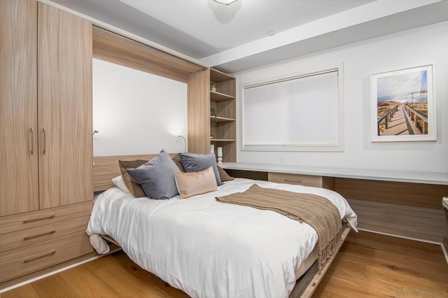 bedroom with light hardwood / wood-style flooring