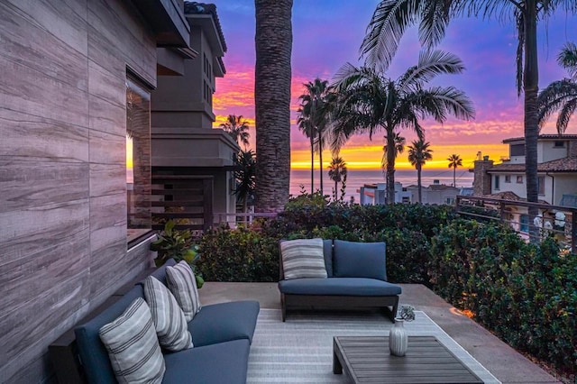 patio terrace at dusk with a water view