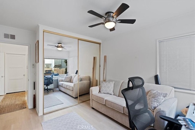 living room with light hardwood / wood-style floors