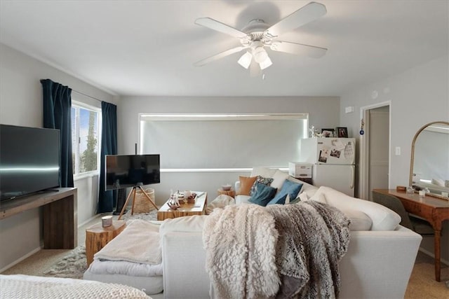 carpeted living room featuring ceiling fan