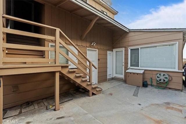 property entrance featuring a patio