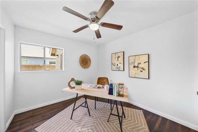 office space with dark wood-type flooring and ceiling fan